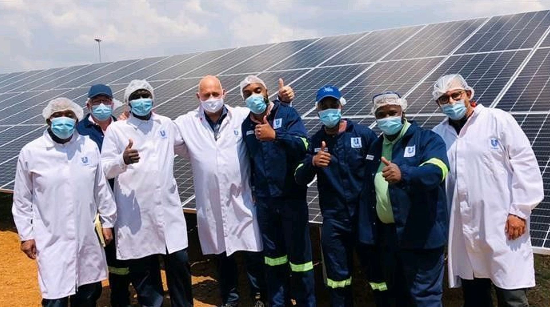 Unilever team beside recent successful solar installation in South Africa 