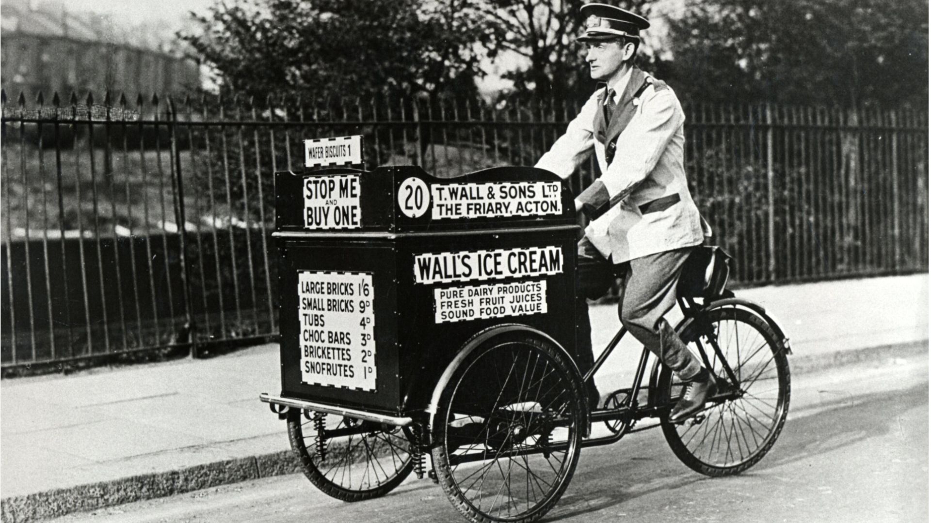 Black and white picture of a man on a Wall’s trike