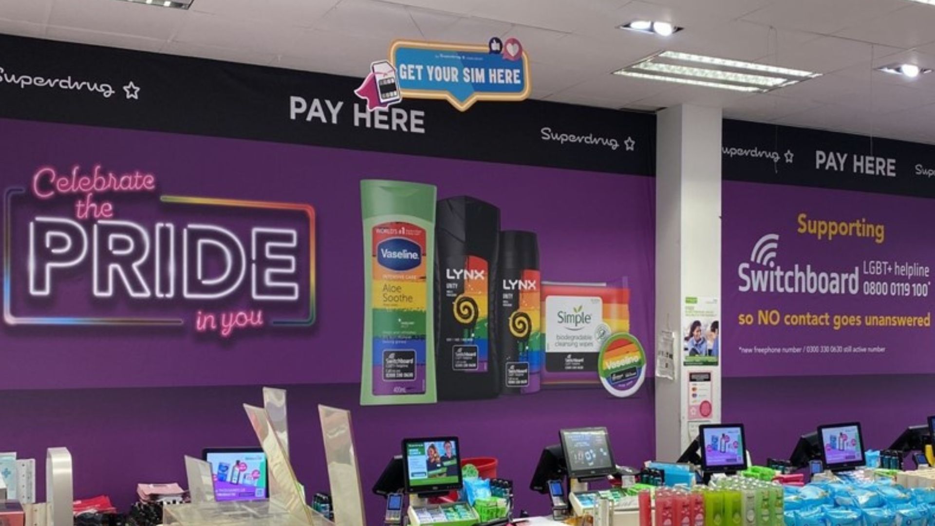  Large 'Celebrate the Pride in you' wall poster showing Pride branded personal care products, and Switchboard contact details