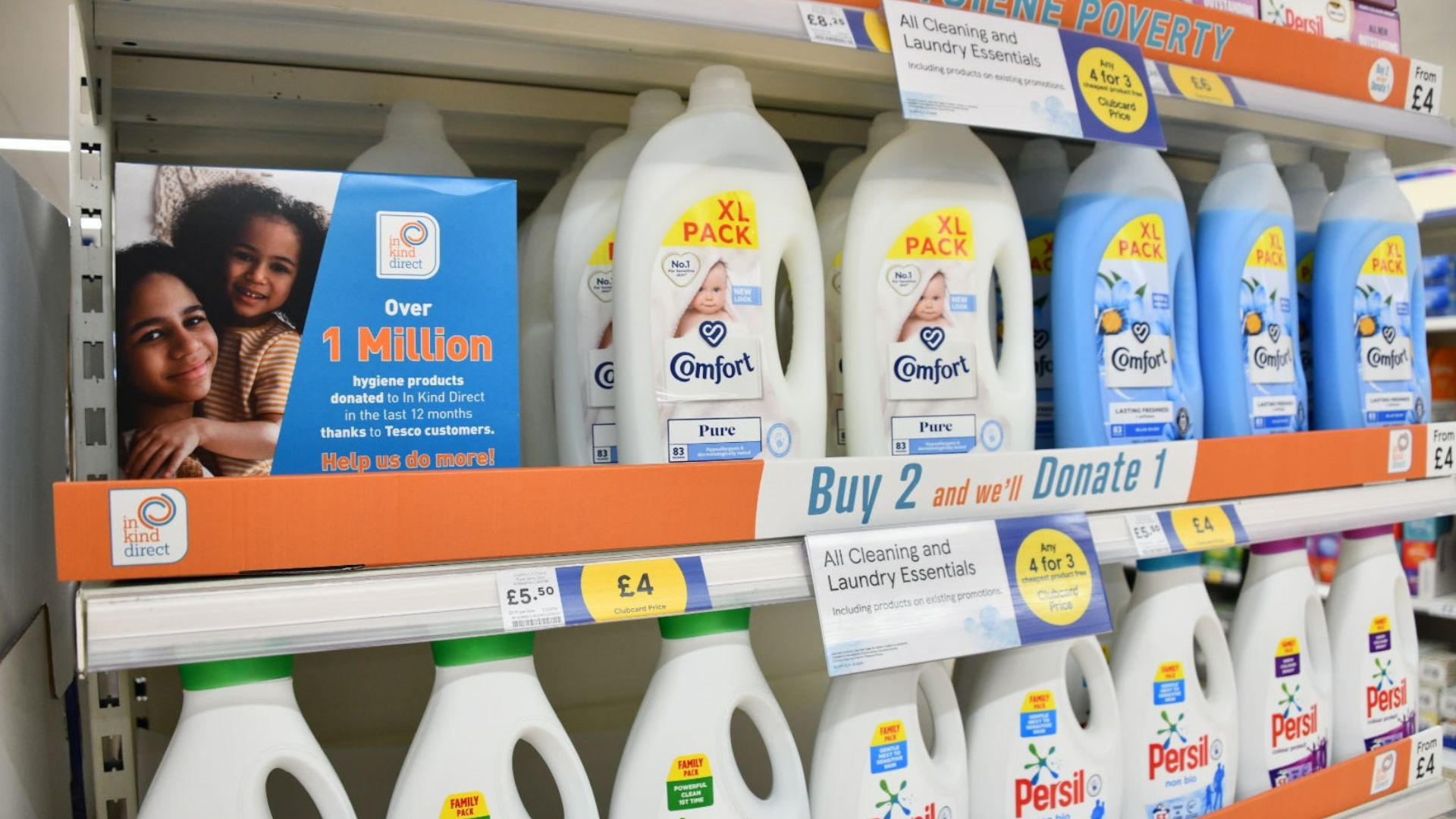Persil and Comfort products on shelf at Tesco with the Hygiene poverty branding on them