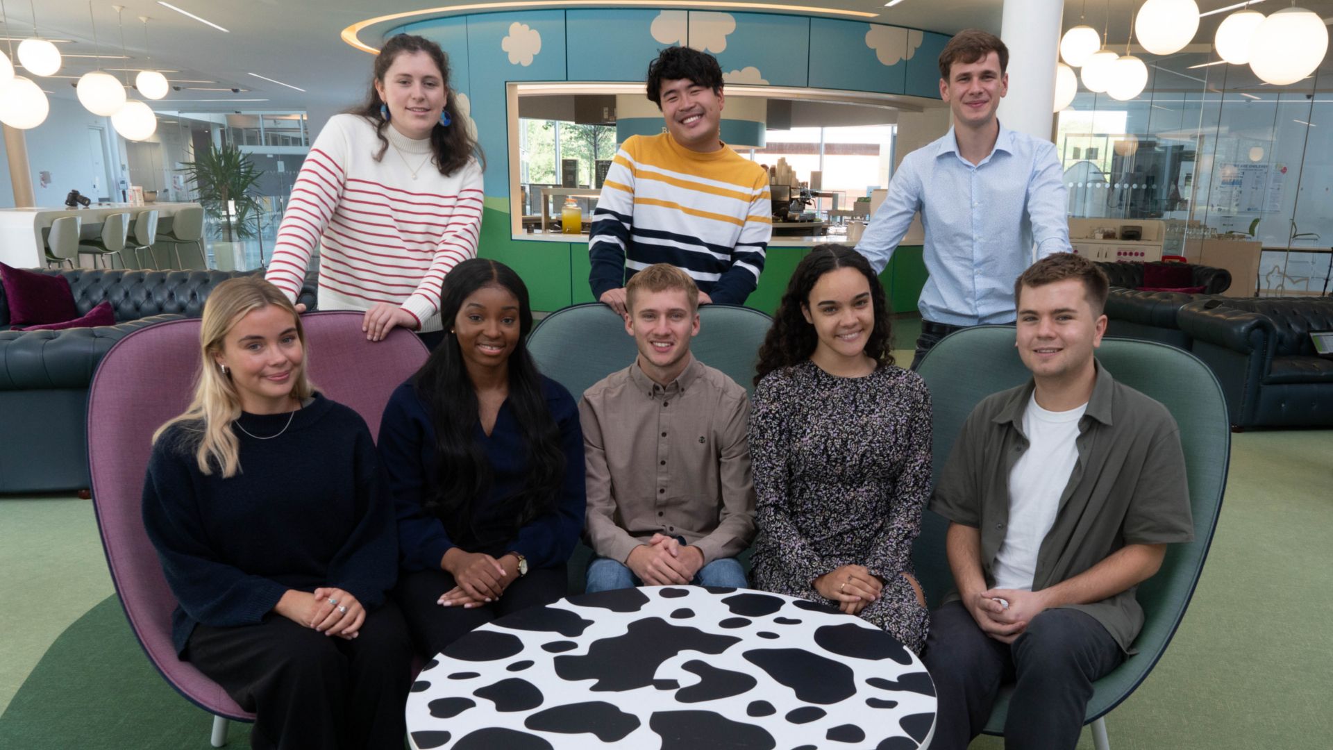 Group of apprentices around a table.