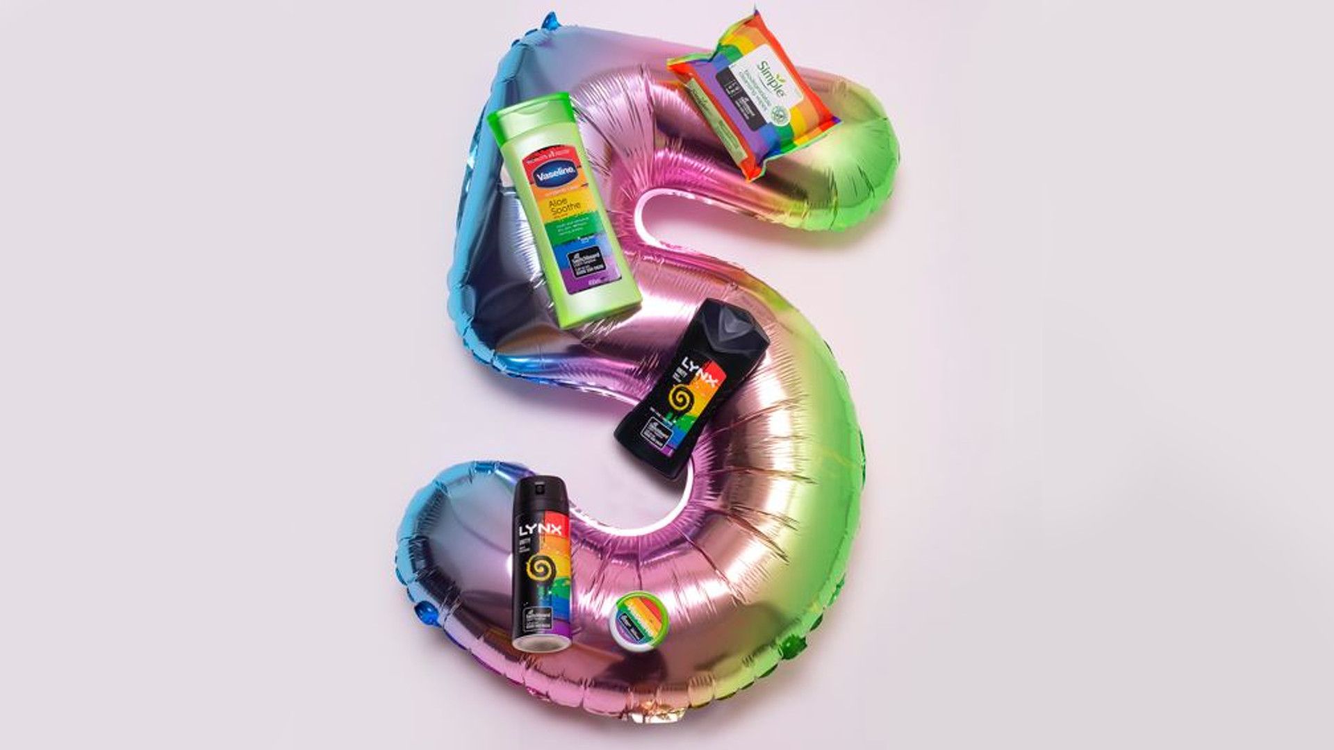 number 5 balloon in rainbow colours with Unilever Pride products