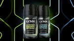 Two Lynx lower body spray bottles side by side, featuring Pear and Cedarwood scent, and Coconut and Sandalwood scent, against a neon background.