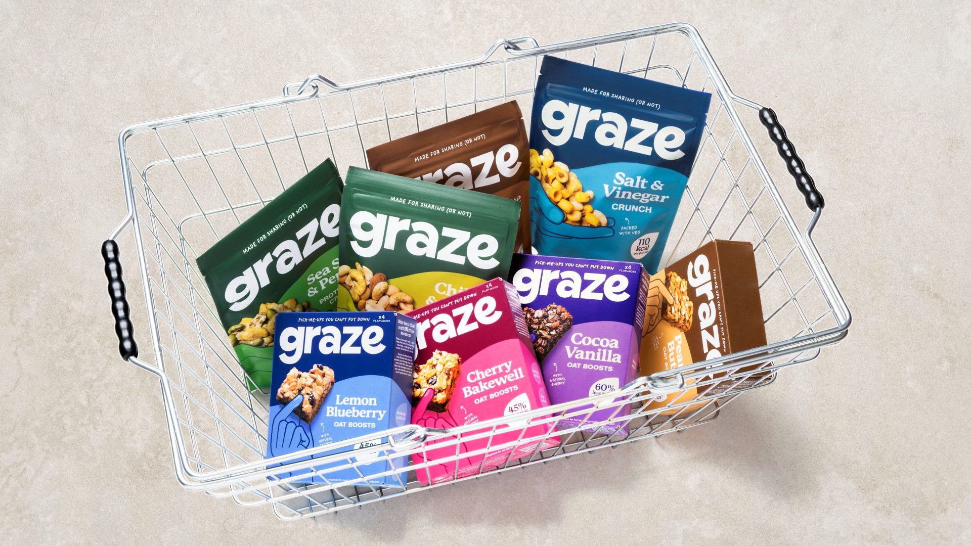 A shopping basket with Graze products.
