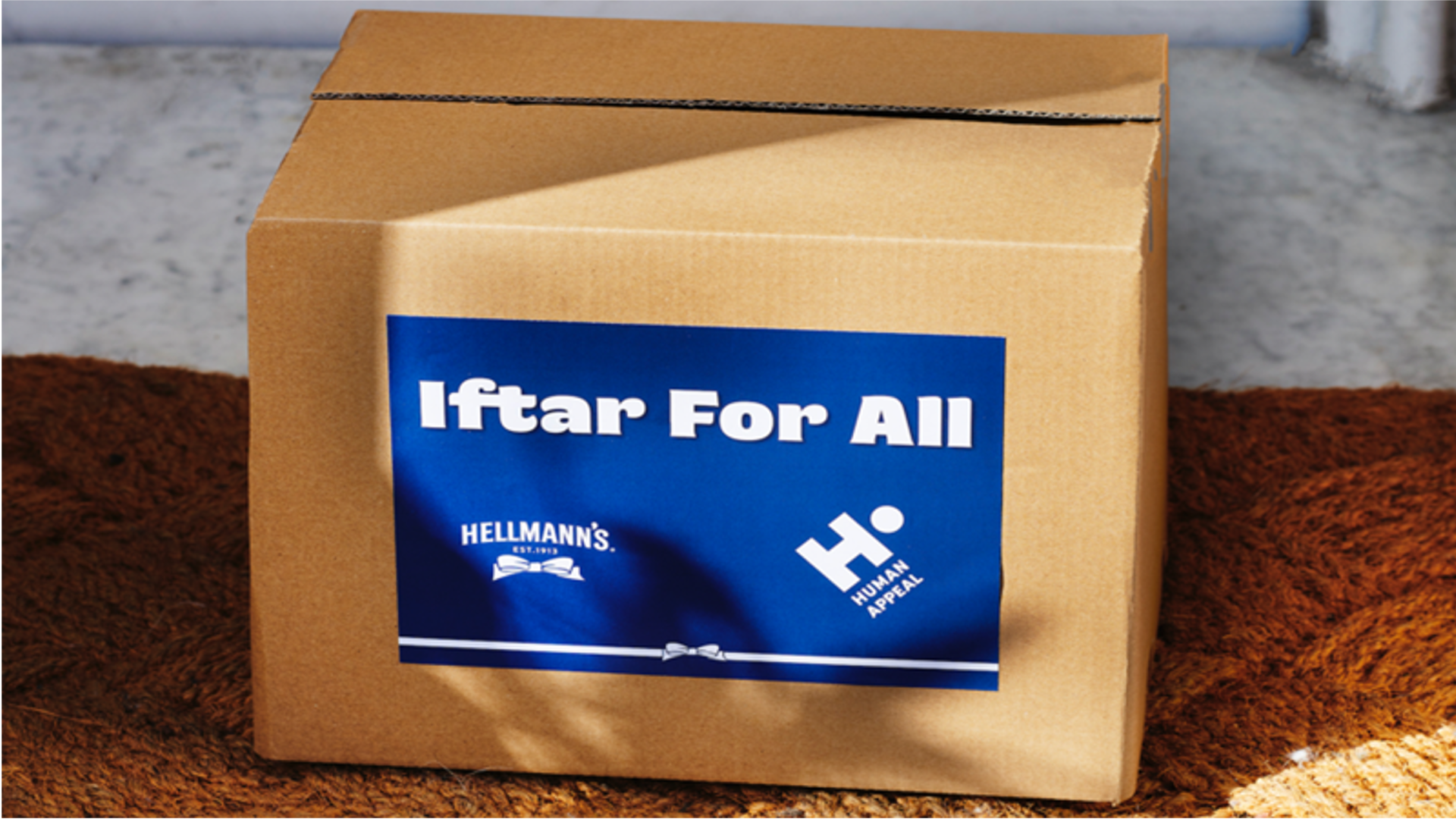 cardboard square box with the image iftar for all on the front