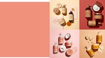 A square divided into four segments, each with different Shea Moisture products in, against a pink background