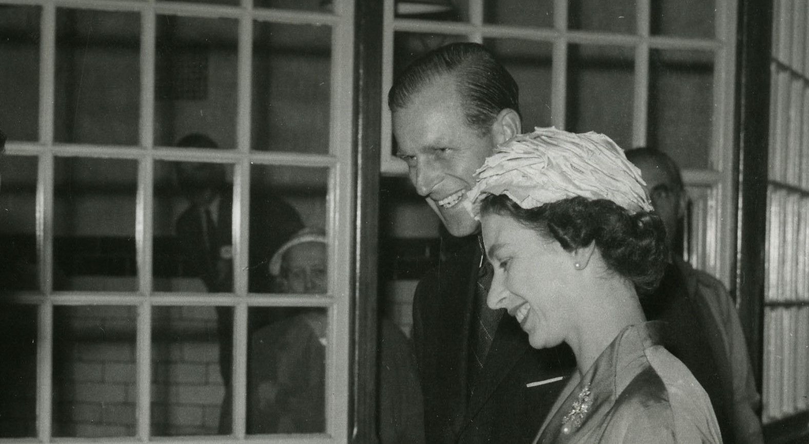 The Queen Elizabeth II and Prince Phillip smiling, during a royal visit to Unilever's soap factory in Port Sunlight
