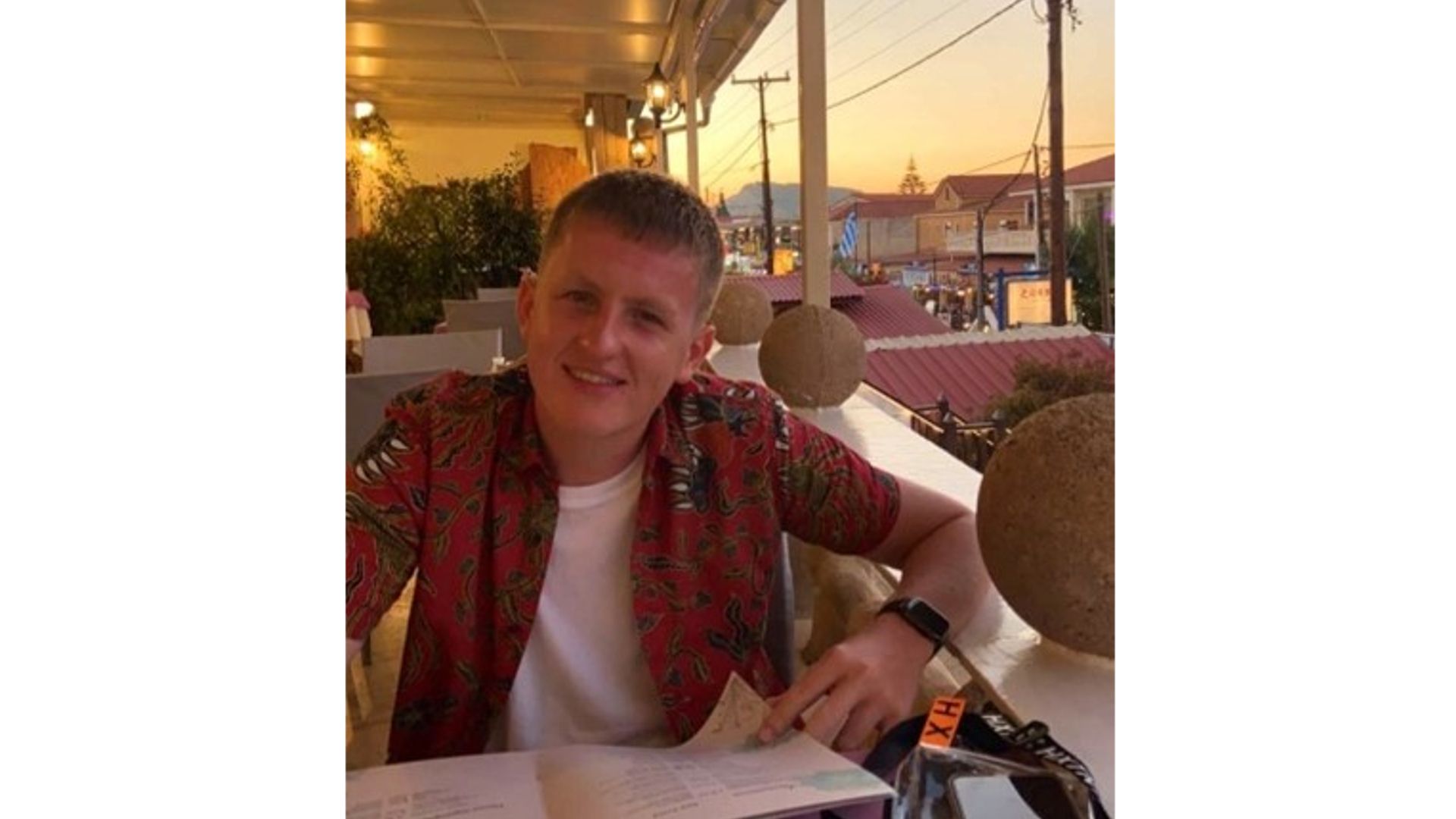 Finley wearing a red shirt smiling 