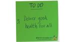 Green sticky note with Deliver good health for alll written on it