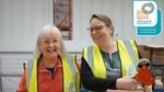 Volunteers smiling in the warehouse of Unilever's charity partner, In Kind Direct