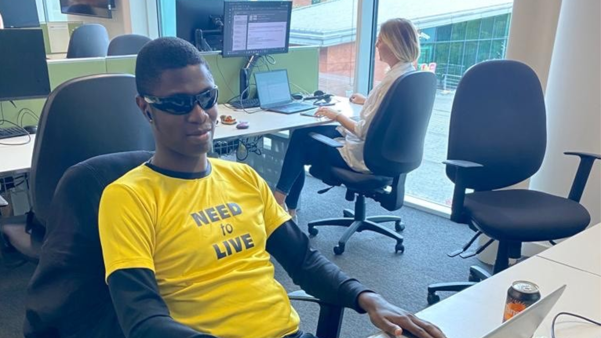 Ademola at his desk working