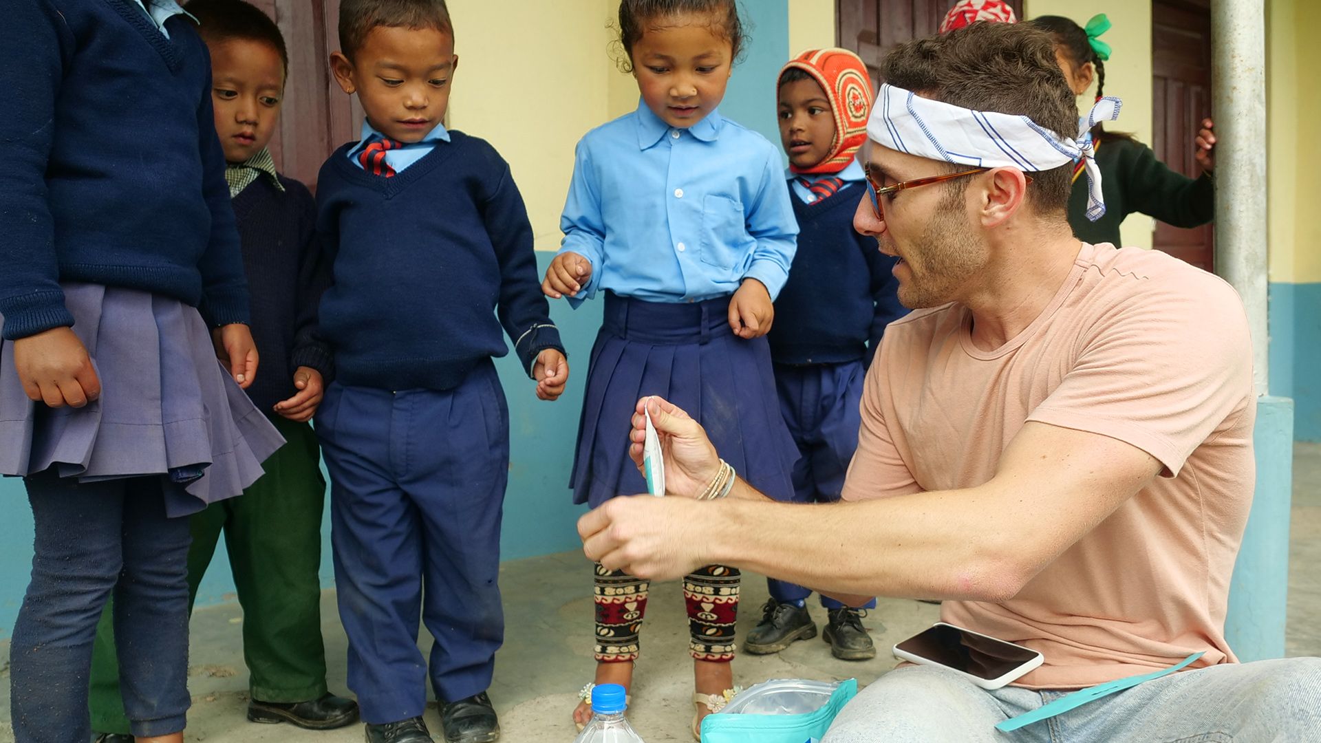 Man showing kids how to use Liquid IV products