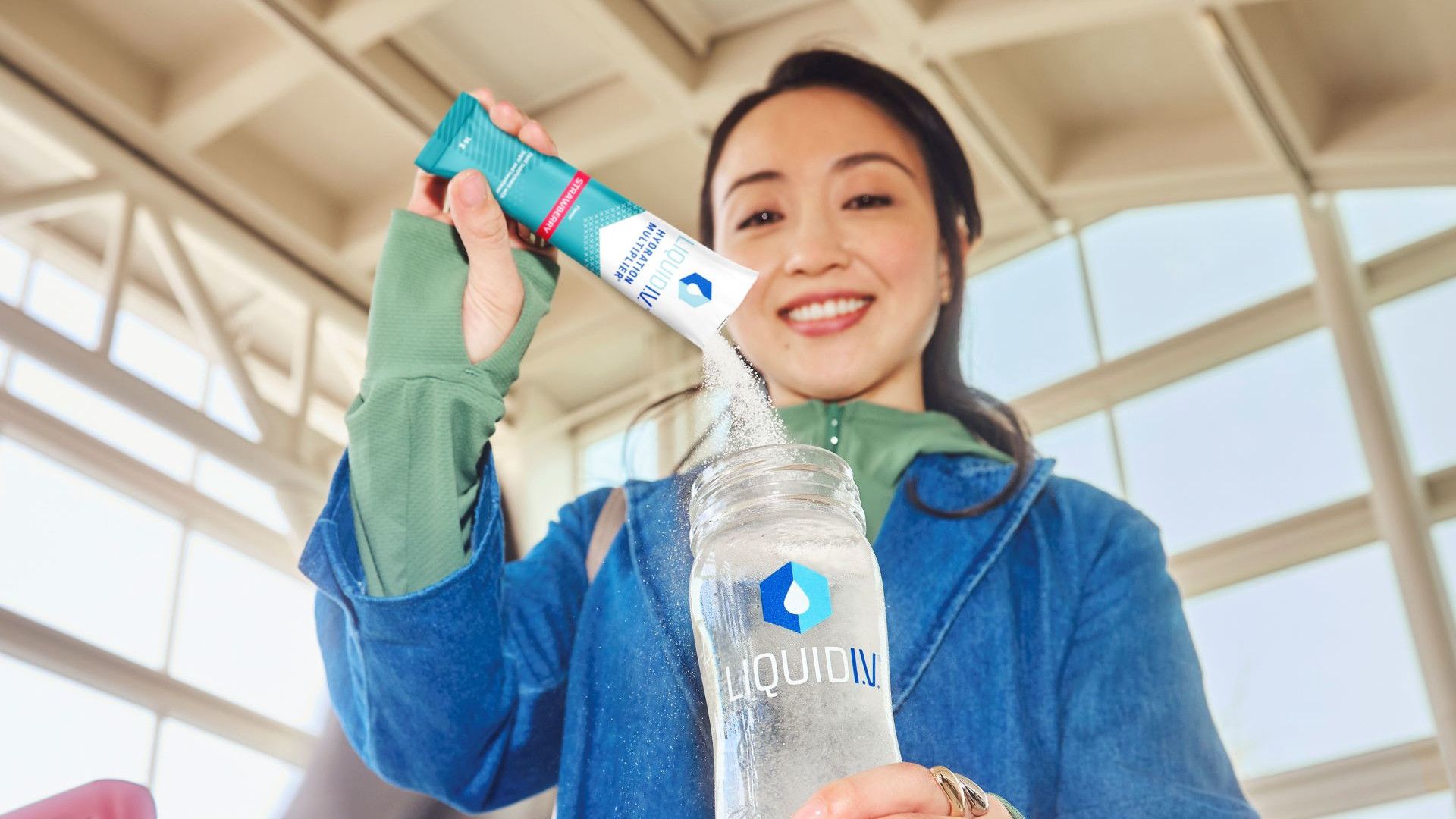 woman using liquid iv in everyday life
